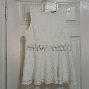Embroidered peplum top. Never worn.